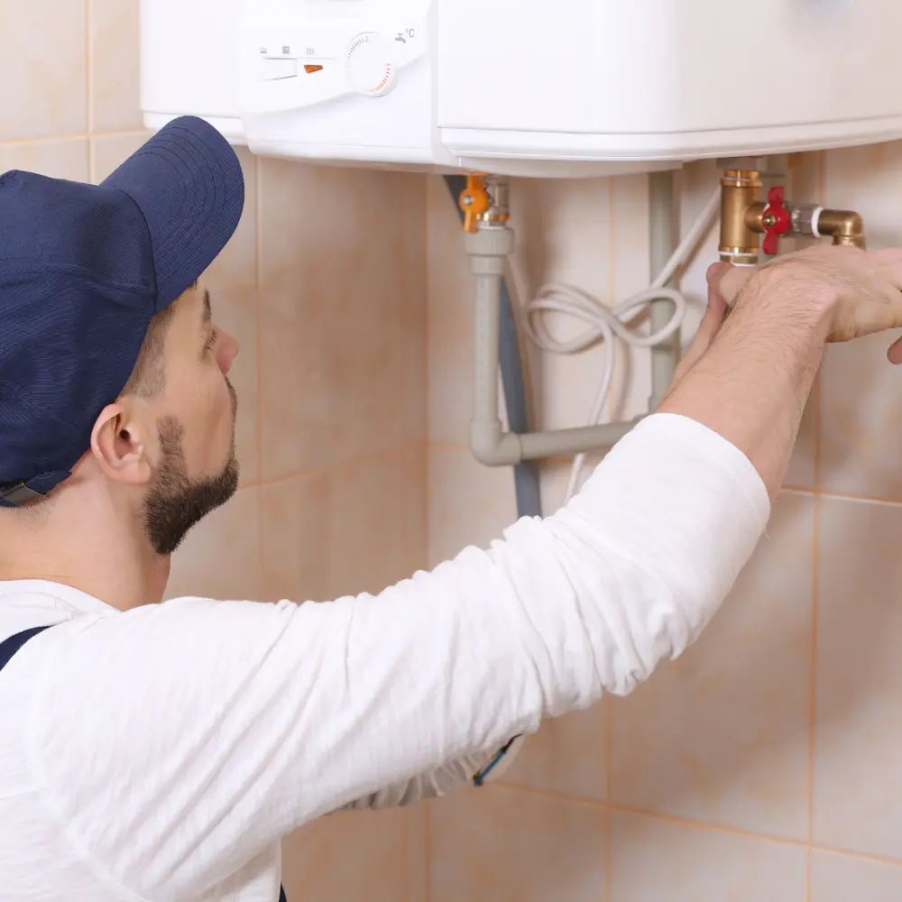 tech working on tankless water heater